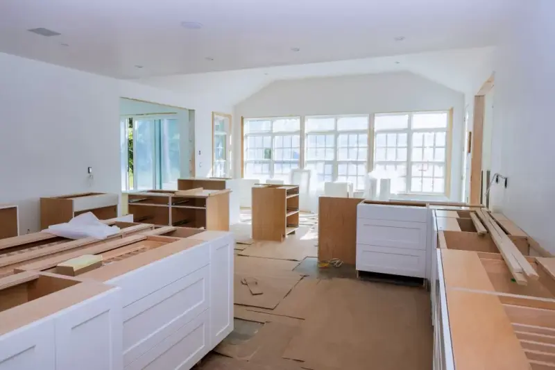 Carpenter fitting bespoke cabinets Callyn Carpentry & Joinery Surrey